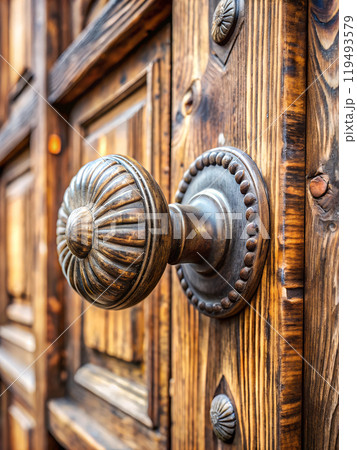 Rustic Wooden Door with Antique Doorknob in Close-Up Rustic Wooden Door with Antique Doorknob in Close-Up 119493579