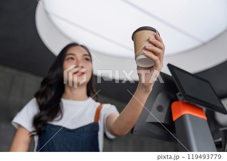 Beautiful Barista Making Coffee in Modern Cafe with Professional Equipment and Warm Smile 119493779