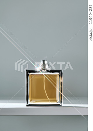 A bottle of yellow perfume with a beautiful highlight. A bottle of yellow perfume with a beautiful highlight. 119494283