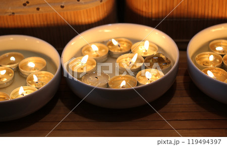 Same Tablet Candles Burns In Round Plates  119494397