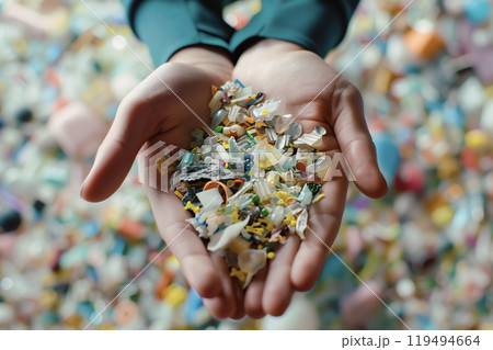 Hands Holding Assorted Microplastic Fragments 119494664