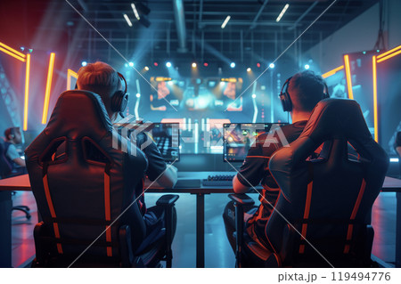 Two esports gamers compete in a high-stakes match at major cybersports championship. Two esports gamers compete in a high-stakes match at major cybersports championship. 119494776