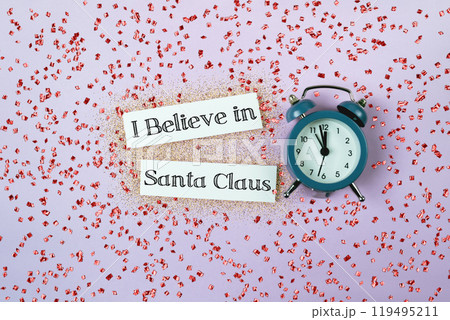 Blue alarm clock with the words I believe in Santa Claus Blue alarm clock with the words I believe in Santa Claus 119495211