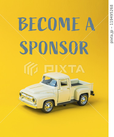 Yellow toy truck with become a sponsor text on yellow background 119495268