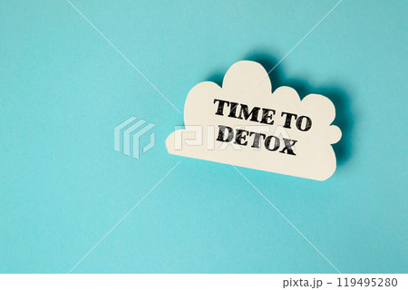 Cloud-shaped paper cutout with TIME TO DETOX on a blue background 119495280