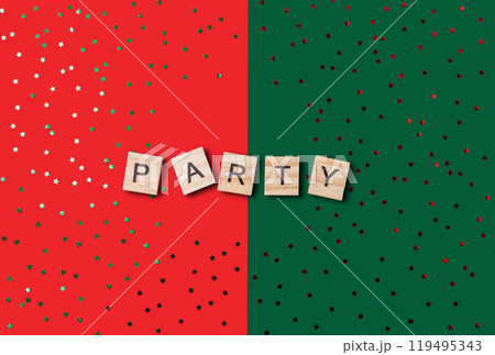 A green and red background with a word party written in wooden blocks A green and red background with a word party written in wooden blocks 119495343