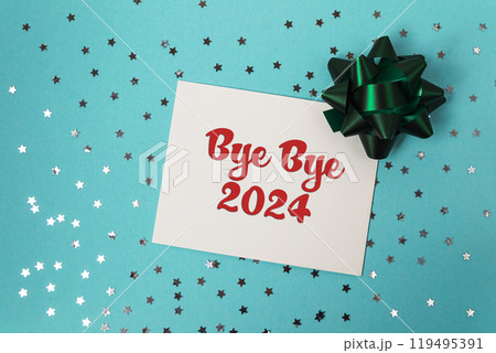 White card with red writing that says bye bye 2024 on it 119495391