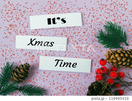 White sign with the words It's Christmas Time written on it 119495410