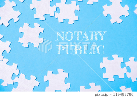 Puzzle with the word notary public written in white on a blue background Puzzle with the word notary public written in white on a blue background 119495796