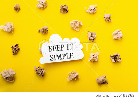 Keep it simple is written in bold black text on a bright yellow background 119495865