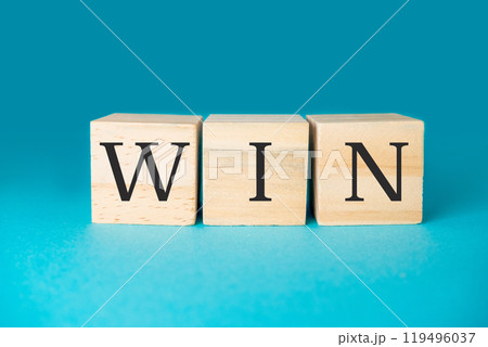 Three wooden blocks with the word WIN written on them Three wooden blocks with the word WIN written on them 119496037