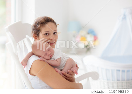 Young mother with newborn baby. Young mother with newborn baby. 119496859
