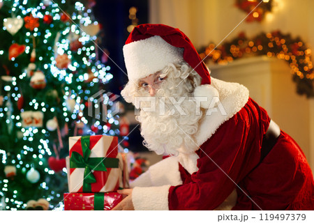 Santa Claus on Christmas eve. Presents under tree. Santa Claus on Christmas eve. Presents under tree. 119497379