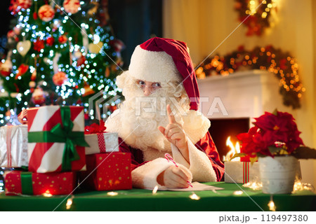 Santa Claus on Christmas eve. Presents under tree. 119497380
