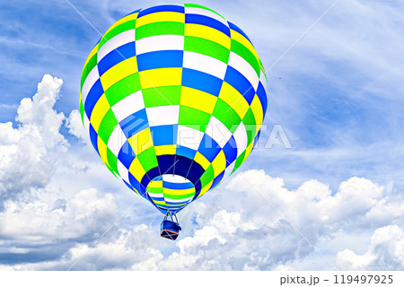Colorful hot air balloon flying over blue sky with white clouds	 119497925