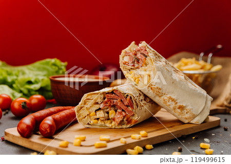 Grilled wrap filled with sausage, corn, and melted cheese. Hearty meal or street food craving Grilled wrap filled with sausage, corn, and melted cheese. Hearty meal or street food craving 119499615