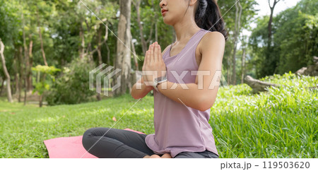 Young Woman Practicing Yoga Outdoors in a Serene Garden Setting, Embracing Relaxation and Mindfulness in Nature Young Woman Practicing Yoga Outdoors in a Serene Garden Setting, Embracing Relaxation and Mindfulness in Nature 119503620