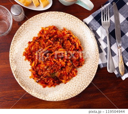 Delicious dish of stewed cabbage with pearl barley 119504944