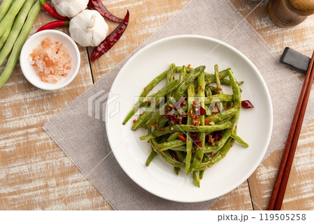 Stir fried french green been with chili and salt in white plate.Top view. Stir fried french green been with chili and salt in white plate.Top view. 119505258