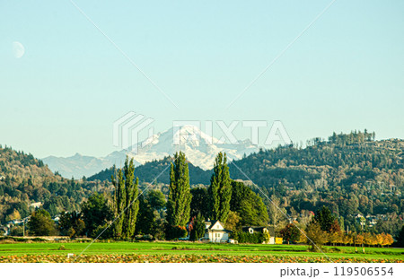 Spectacular view of Fraser Valley countryside around Chilliwack, BC, Canada. Snow covere d peaks of Mt. Baker visible in the background 119506554