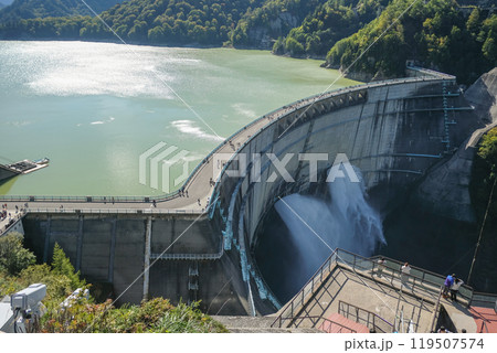 Kurobe Dam, Tateyama, Toyama, Chubu, Japan A scenic view of a dam, with water flowing over the edge 119507574