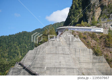 Kurobe Dam, Tateyama, Toyama, Chubu, Japan A scenic view of a terraced mountain structure with greenery and a pathway Kurobe Dam, Tateyama, Toyama, Chubu, Japan A scenic view of a terraced mountain structure with greenery and a pathway 119507667