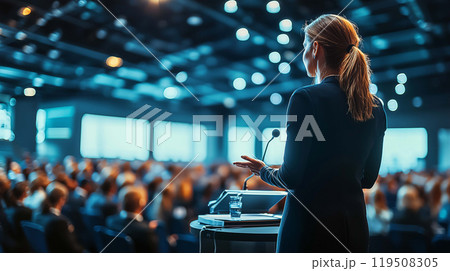 Female Scholar Delivering an Engaging Lecture to a Packed Conference Room Audience 119508305
