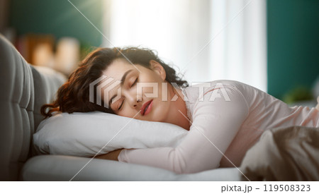 woman is sleeping in the bedroom 119508323