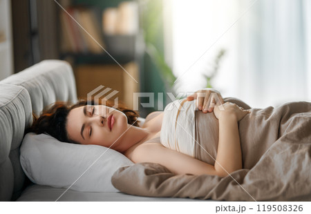 woman is sleeping in the bedroom woman is sleeping in the bedroom 119508326