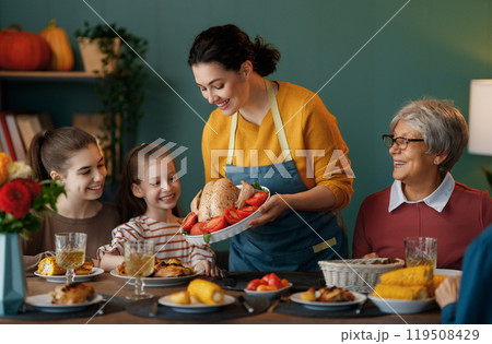 Family celebrating Thanksgiving Day 119508429