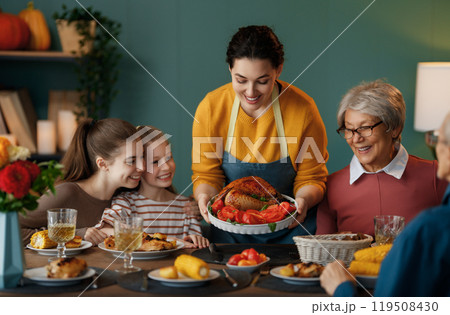 Family celebrating Thanksgiving Day 119508430