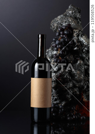 Bottle of red wine with empty label. 119508526