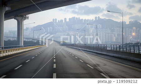 Road, bathed in the soft luminescence of streetlights, leads directly to the capital city 119509212