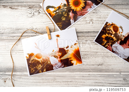 Printed colorful photos of women portraits against gray background 119509753