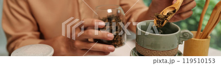 Man Brewing Herbal Tea At Home Man Brewing Herbal Tea At Home 119510153