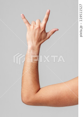 A person hand gesture against a neutral background 119511527