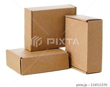 Stacked brown cardboard boxes in various sizes arranged on a white background 119511570