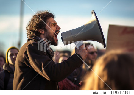 A male activist, demanding justice for human rights during a spirited rally. 119512391