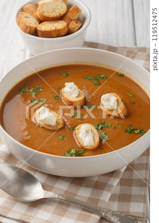 Provencal traditional fish soup puree Soupe de Poisson served with croutons and aioli sauce closeup on the bowl. Vertical Provencal traditional fish soup puree Soupe de Poisson served with croutons and aioli sauce closeup on the bowl. Vertical 119512475