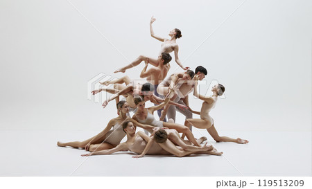 Ballet dancers in dynamic artistic pose. Young men and women performing with beauty and elegance. 119513209
