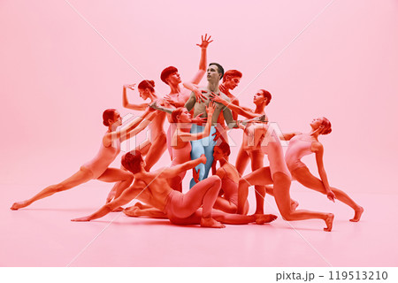 Graceful dance ensemble in synchronized movement. Group of young ballet dancers performing in red tones. Freedom Graceful dance ensemble in synchronized movement. Group of young ballet dancers performing in red tones. Freedom 119513210
