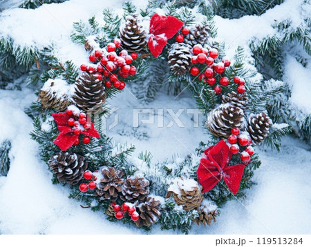 Snowy Christmas Wreath with Pine Cones and Red Berries Snowy Christmas Wreath with Pine Cones and Red Berries 119513284