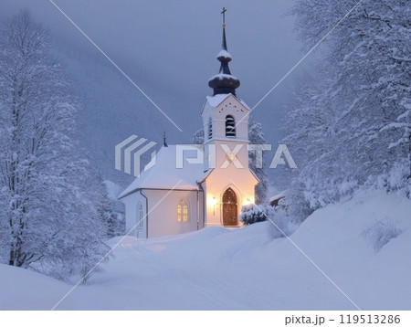 Snowy Church with a Lighted Door in a Winter Landscape Snowy Church with a Lighted Door in a Winter Landscape 119513286