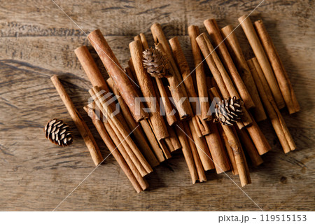 cinnamon sticks on wooden background 119515153