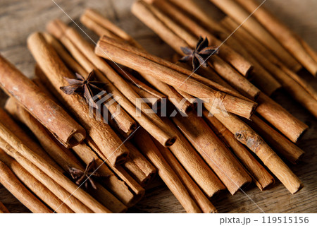 cinnamon sticks on wooden background 119515156