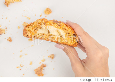 Cookies in hand. homemade oatmeal cookies filled with cheese on a light background, top view Cookies in hand. homemade oatmeal cookies filled with cheese on a light background, top view 119515603