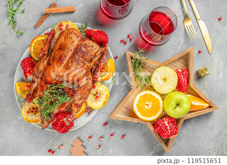 Christmas Dinner. Roasted duck with oranges, berries and herbs. top view Christmas Dinner. Roasted duck with oranges, berries and herbs. top view 119515651