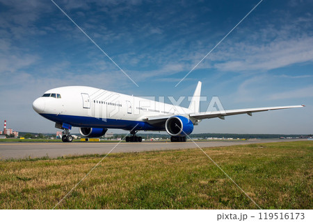 Wide body passenger airplane taxiing on the main taxiway Wide body passenger airplane taxiing on the main taxiway 119516173