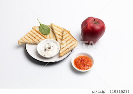 Homemade grilled toasts for breakfast on white plate. Homemade grilled toasts for breakfast on white plate. 119516251