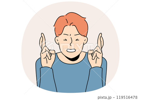 Superstitious man crosses fingers and closes eyes in hope of fulfilling wish or lucky fate 119516478